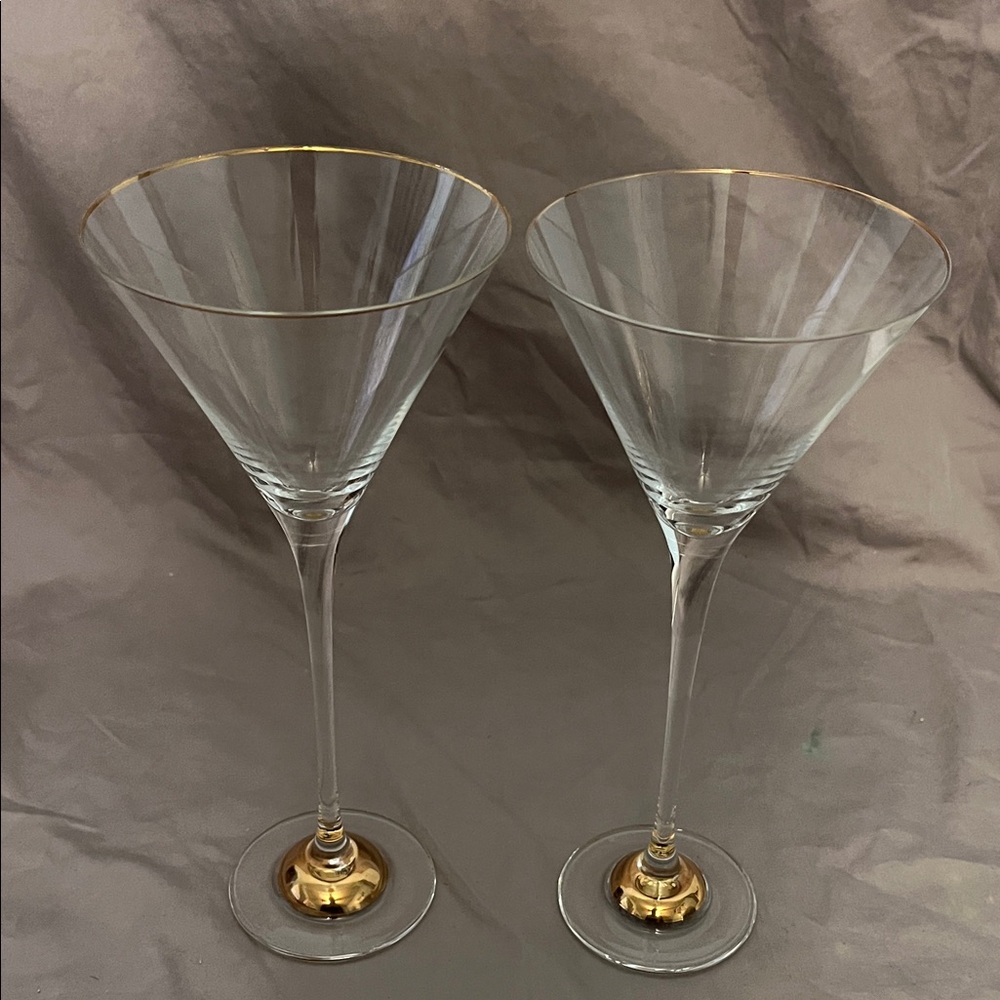Set of two tall gold rimmed and gold base wine glasses